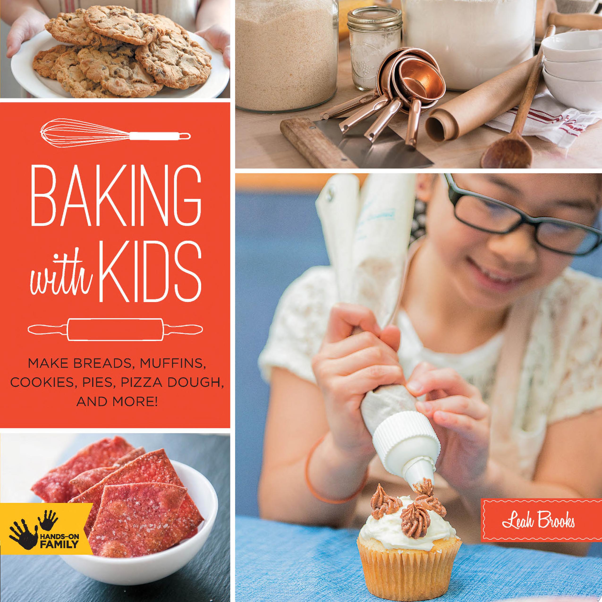 Photo of a child decorating a cupcake as well plated cookies, crackers, and baking tools